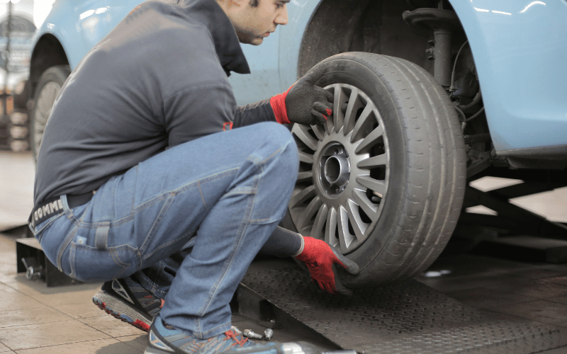 Car Tyres - man changing his car tyre